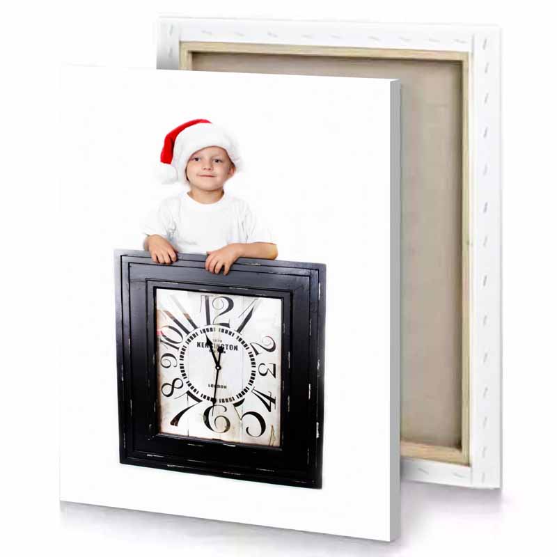 a baby in santa hat is sitting on clock snow canvas