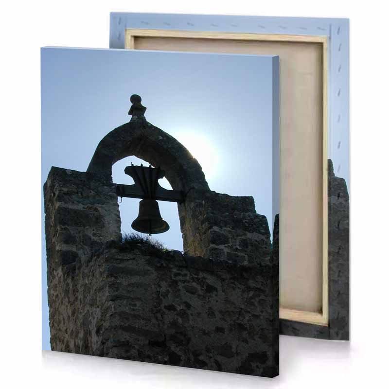 a bell is on the side of stone building periwinkle canvas