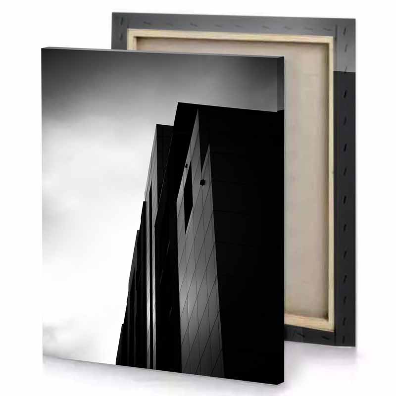 a black and white photo of building smoke canvas