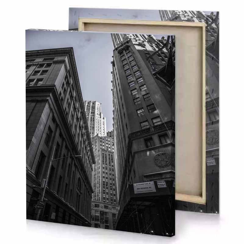 a black and white photo of city street silver canvas