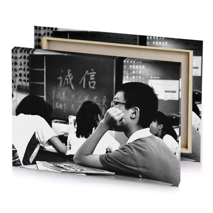a black and white photo of man sitting at desk smoky canvas