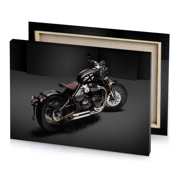 a black motorcycle parked in dark room charcoal canvas