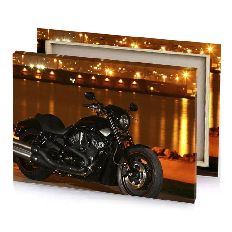 a black motorcycle parked on the side of road sepia canvas