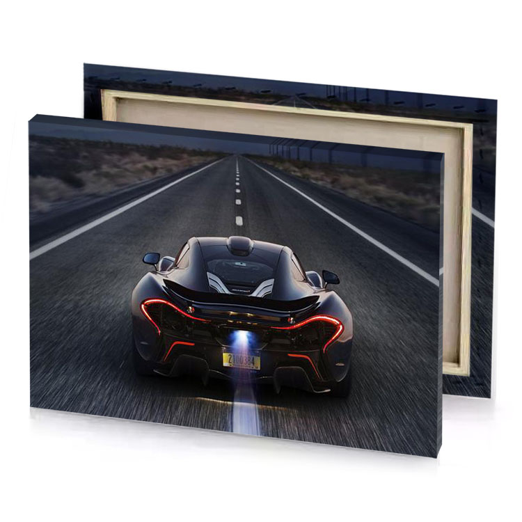 a black sports car driving down road zinnwaldite brown canvas