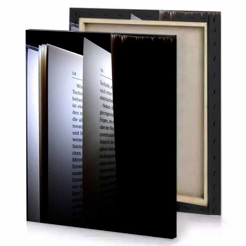 a book with light shining on it steel blue canvas