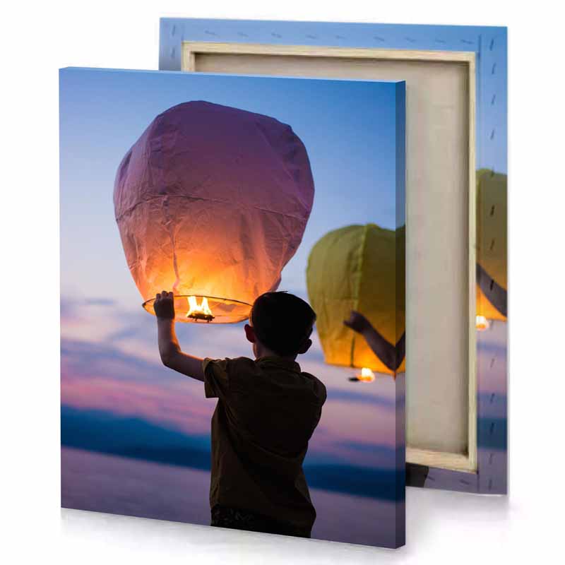 a boy holding lit up paper lantern bittersweet shimmer canvas
