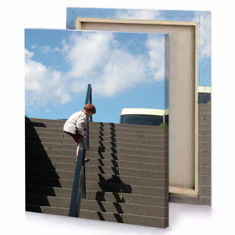 a boy is climbing up some stairs light steel blue canvas