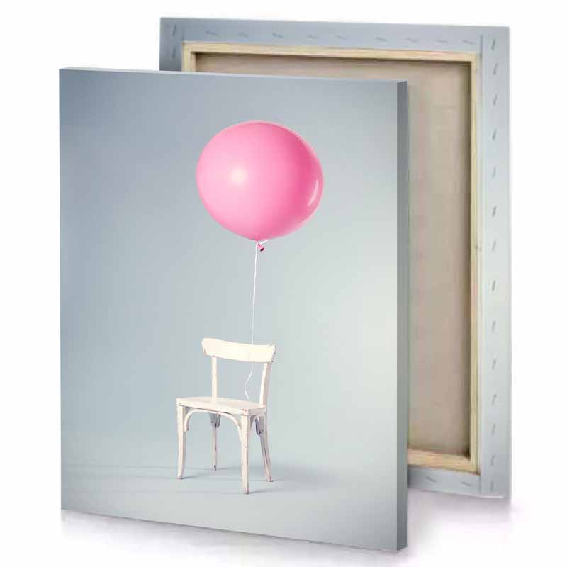 a chair with pink balloon attached to it cherry blossom canvas