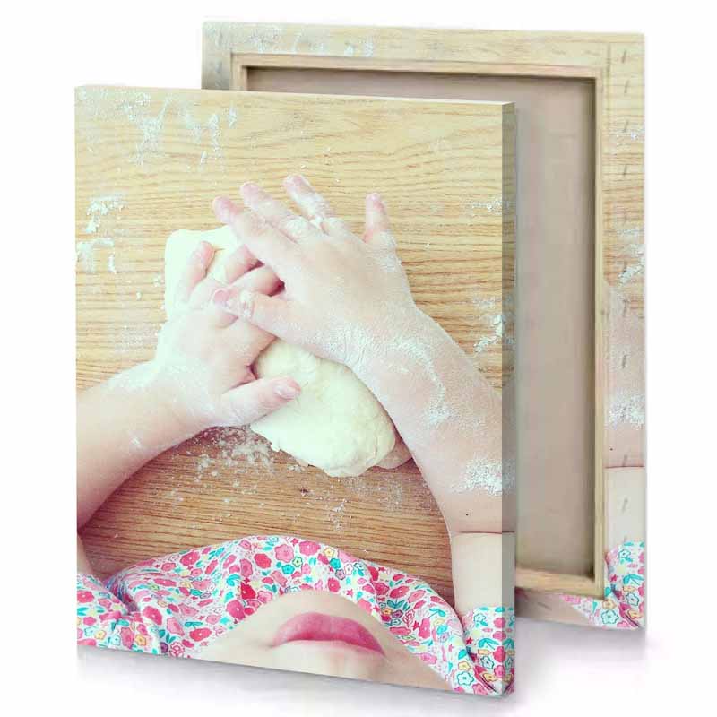 a child is making dough on table rosy brown canvas