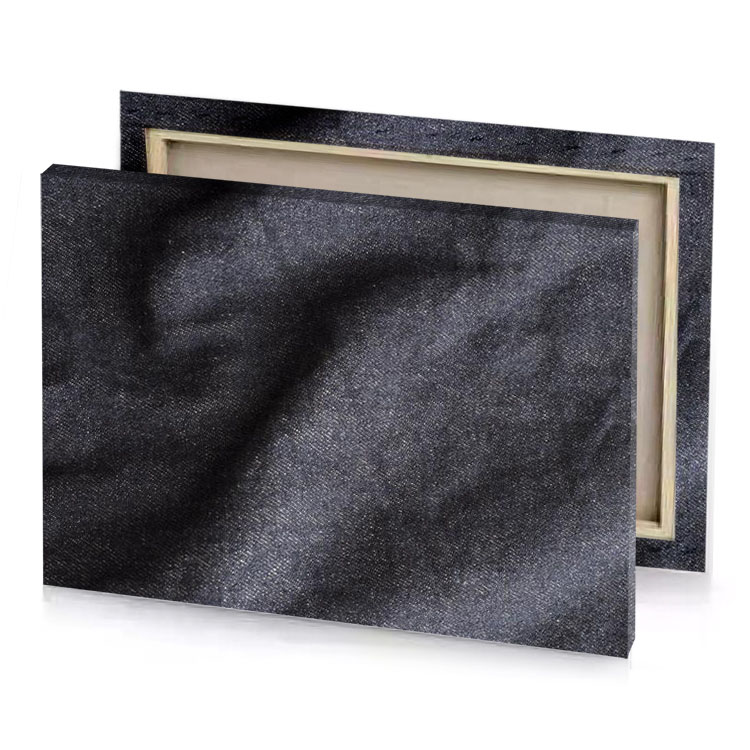 a close up of blue denim fabric dim gray canvas