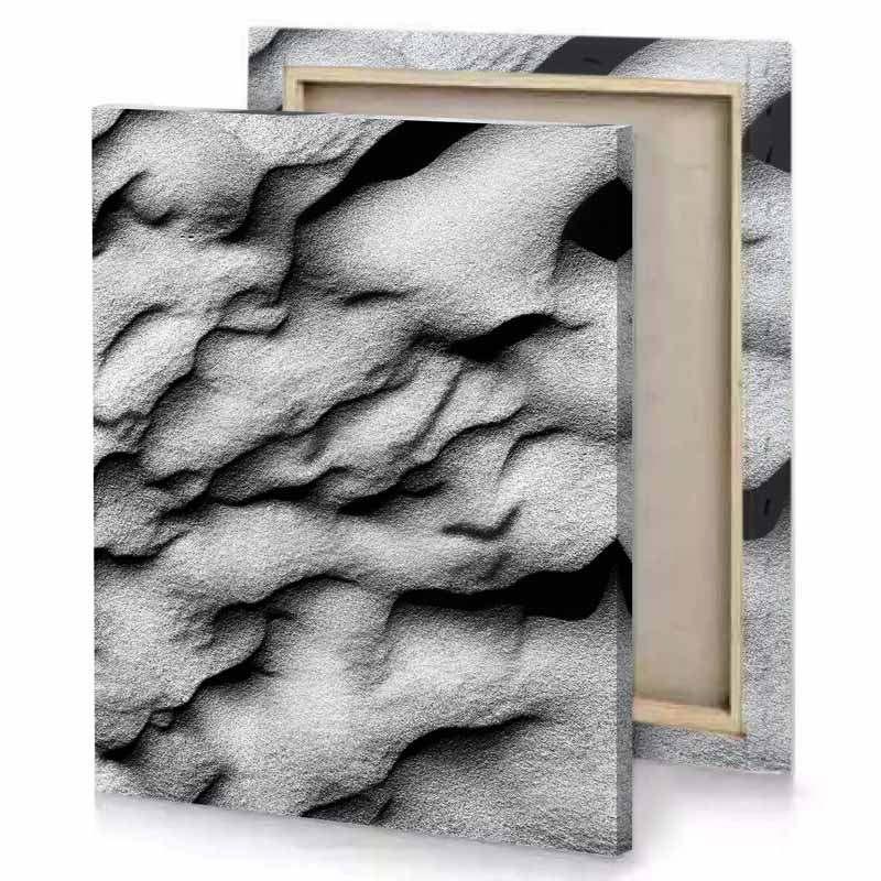 a close up of rock with black background silver canvas