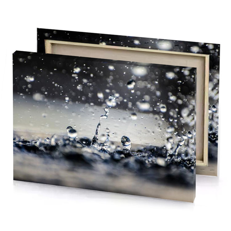 a close up of water droplets on surface silver canvas
