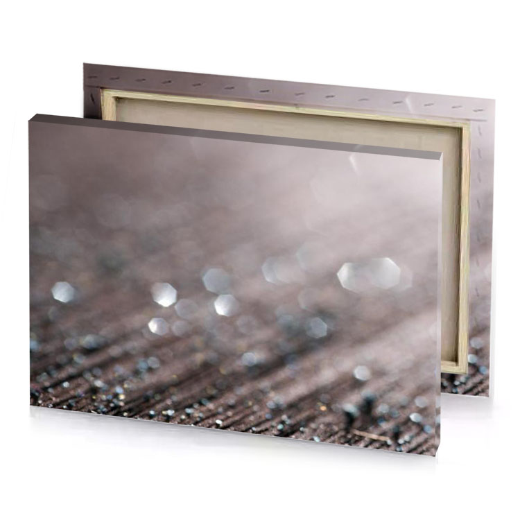 a close up of wooden table with water droplets gray canvas