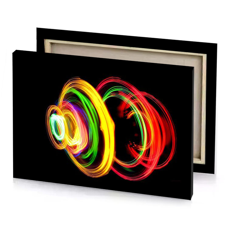 a colorful light painting on black background canary yellow canvas