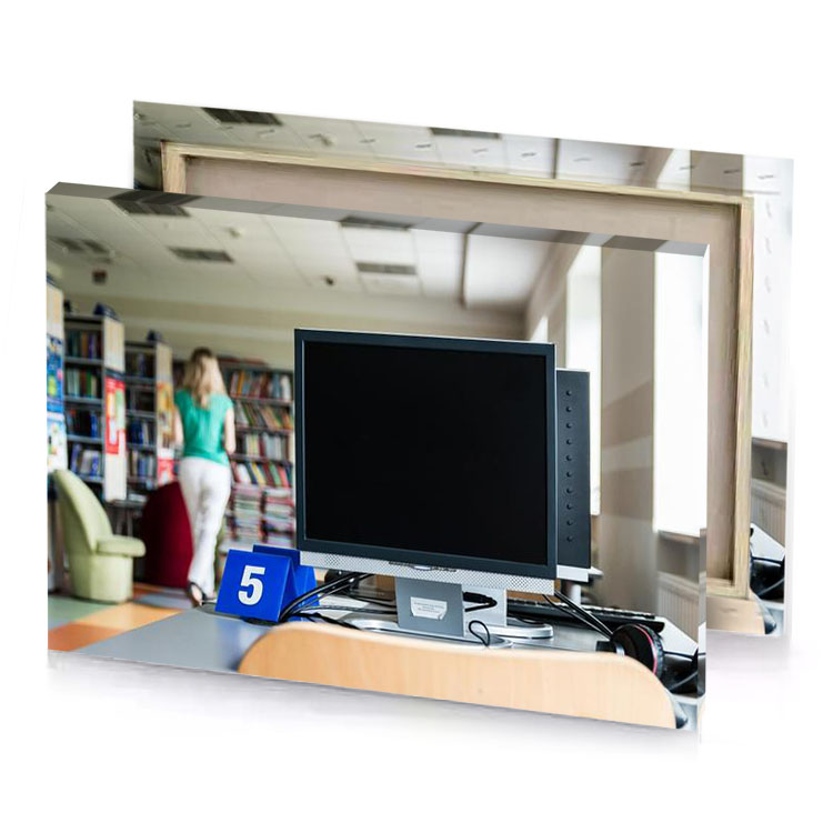 a computer monitor sitting on desk in library smoky black canvas