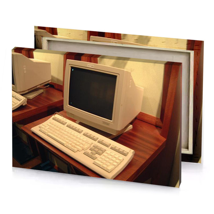 a computer on wooden table dark khaki canvas