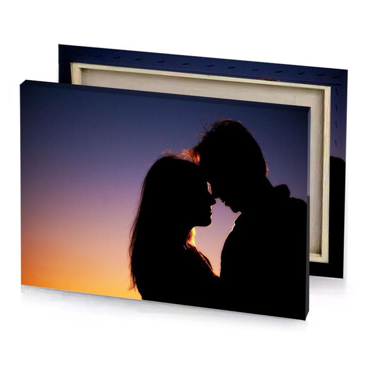 a couple is silhouetted against sunset charcoal canvas