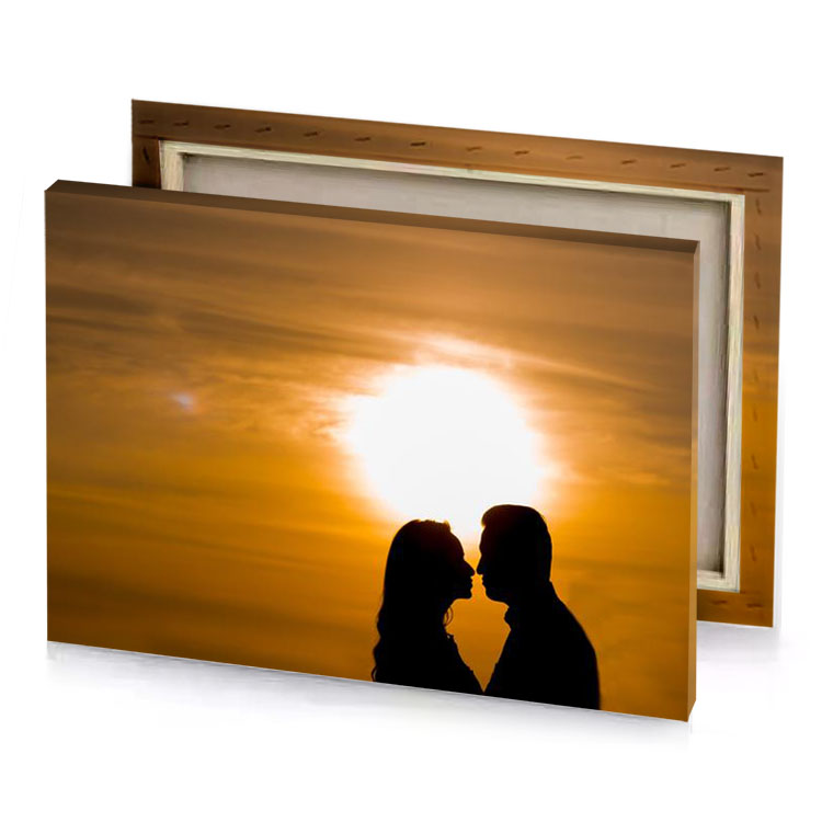 a couple kissing in front of sunset carrot orange canvas