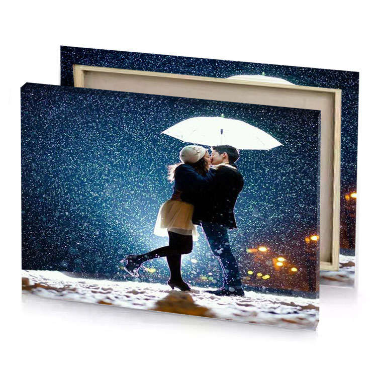 a couple kissing in the rain blue sapphire canvas