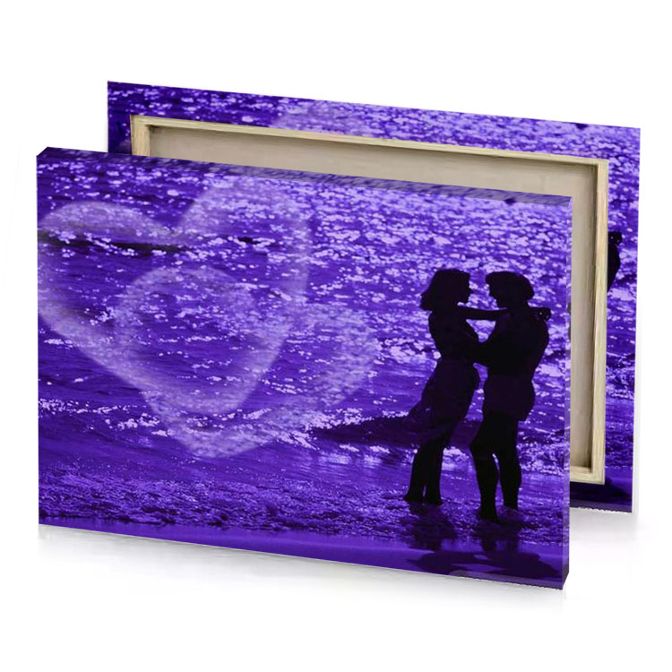 a couple kissing on the beach at night amethyst canvas