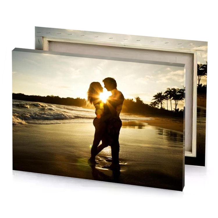 a couple kissing on the beach at sunset burlywood canvas
