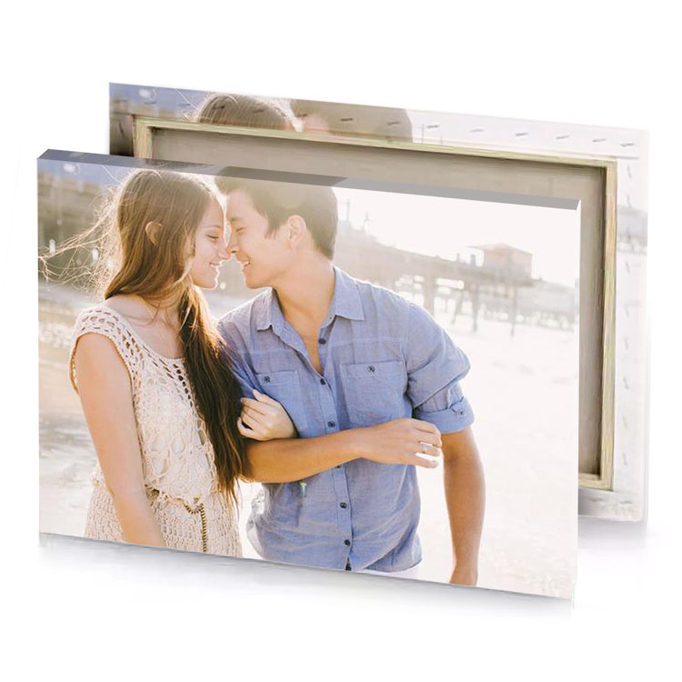 a couple kissing on the beach manatee canvas