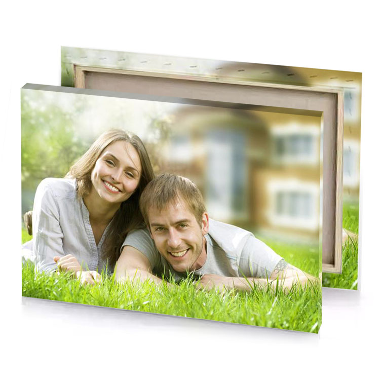 a couple laying in the grass tan canvas