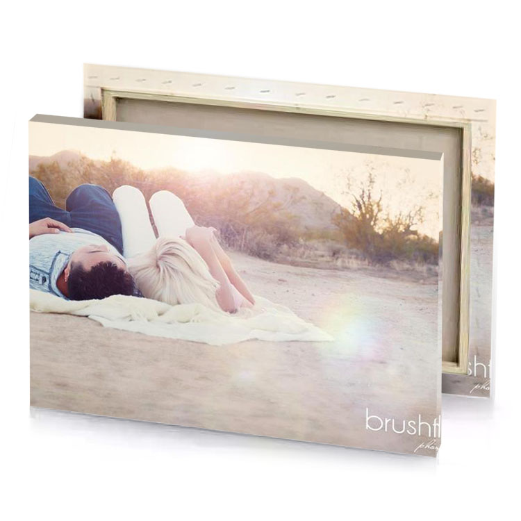 a couple laying on the ground in desert silver canvas