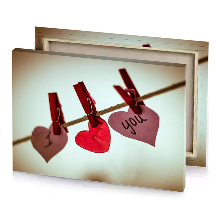a couple of hearts hanging on clothes line spanish red canvas