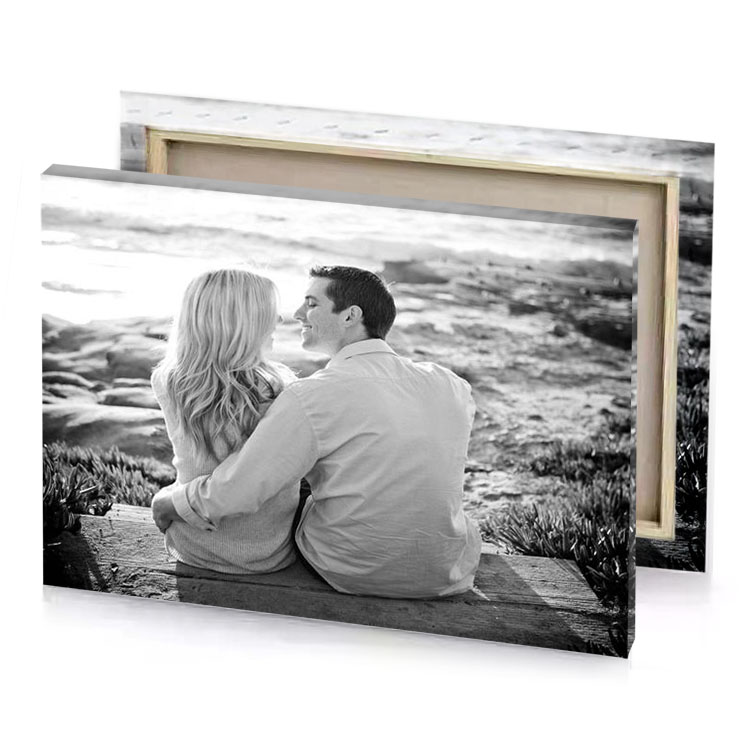 a couple sitting on bench looking at each other people silver canvas