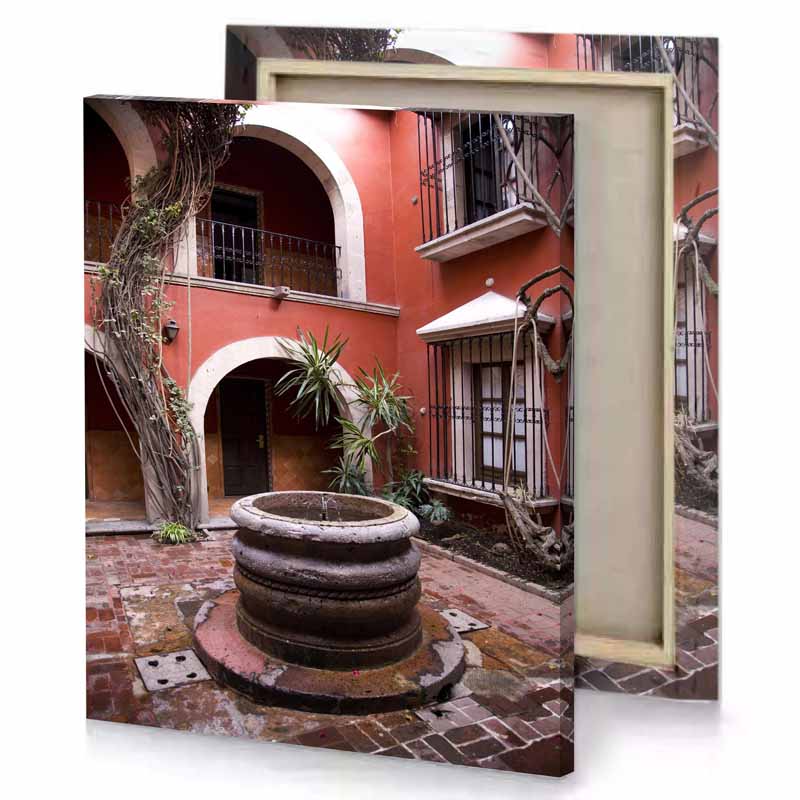 a courtyard with fountain and tree bittersweet shimmer canvas