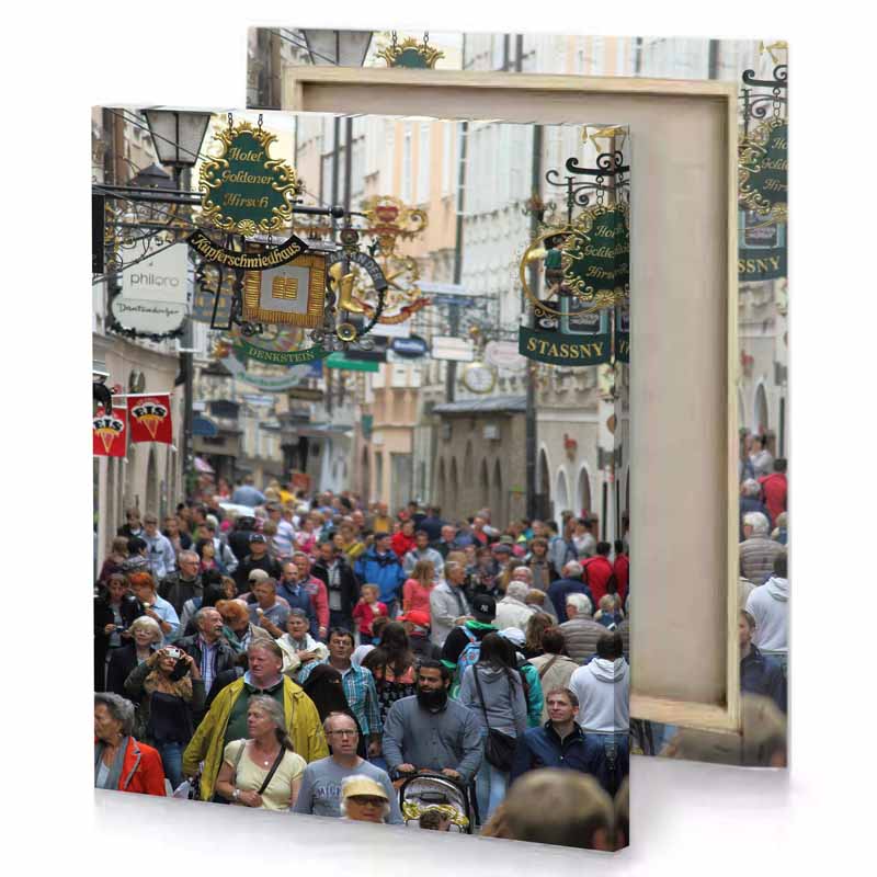 a crowd of people walking down street camouflage green canvas