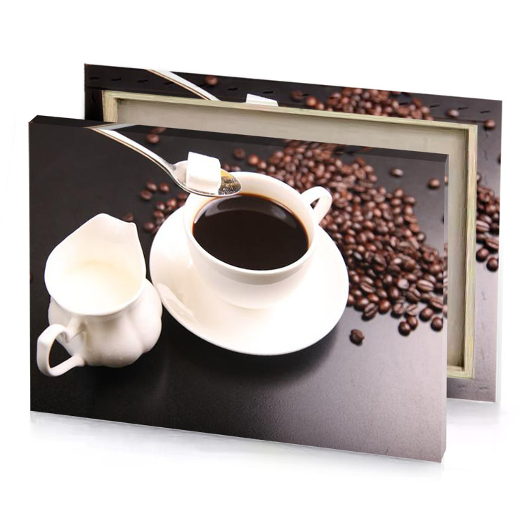 a cup of coffee and spoon on table linen canvas
