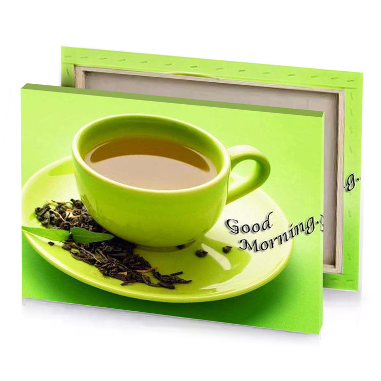 a cup of tea with the words good morning yellow green canvas