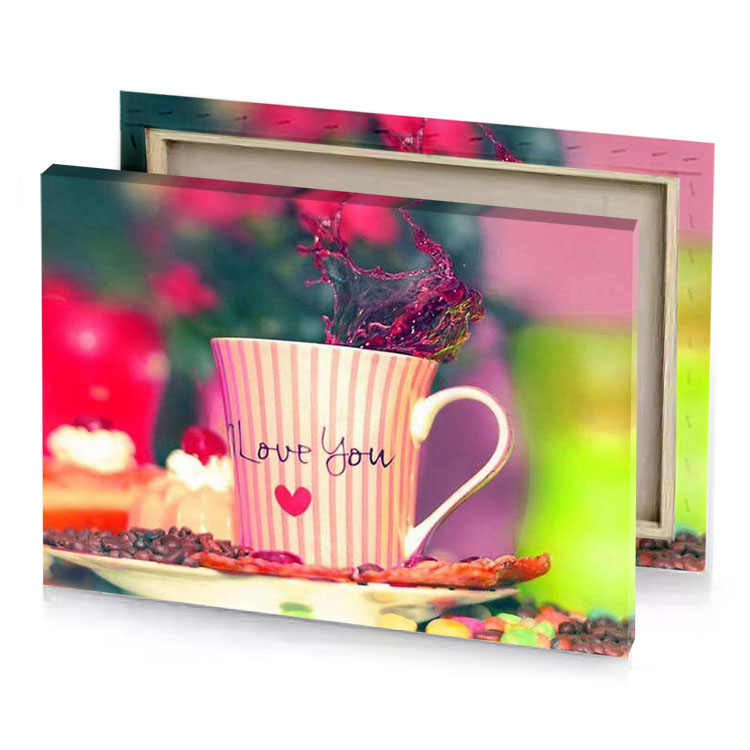 a cup with heart on it and small flower in peach canvas