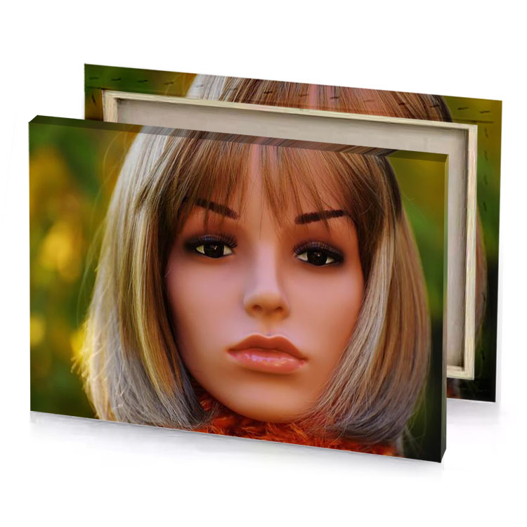 a doll with blonde hair and orange scarf taupe canvas