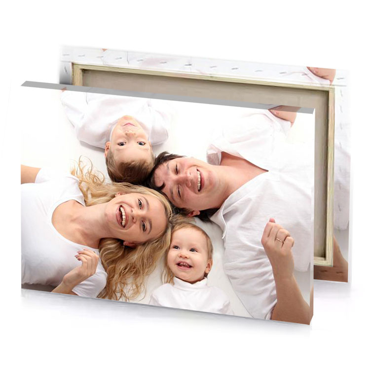 a family of four laying on bed white smoke canvas