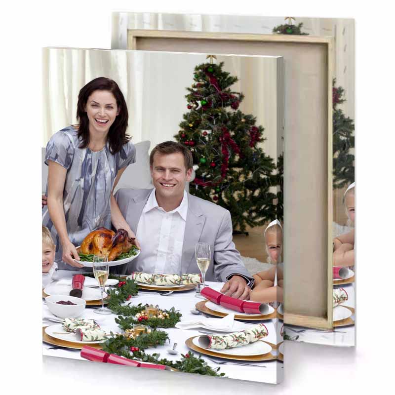 a family sitting at table platinum canvas