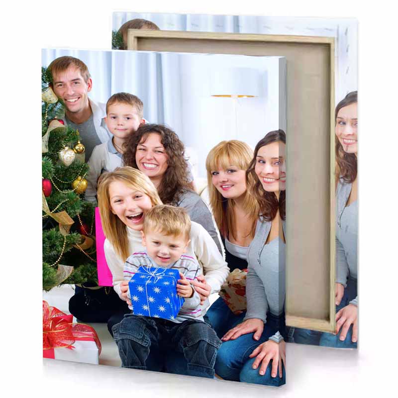 a family sitting in front of christmas tree lavender canvas