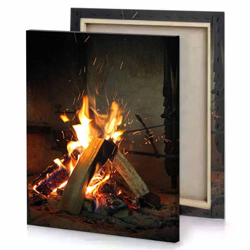 a fire is burning in fireplace with stick sand brown canvas