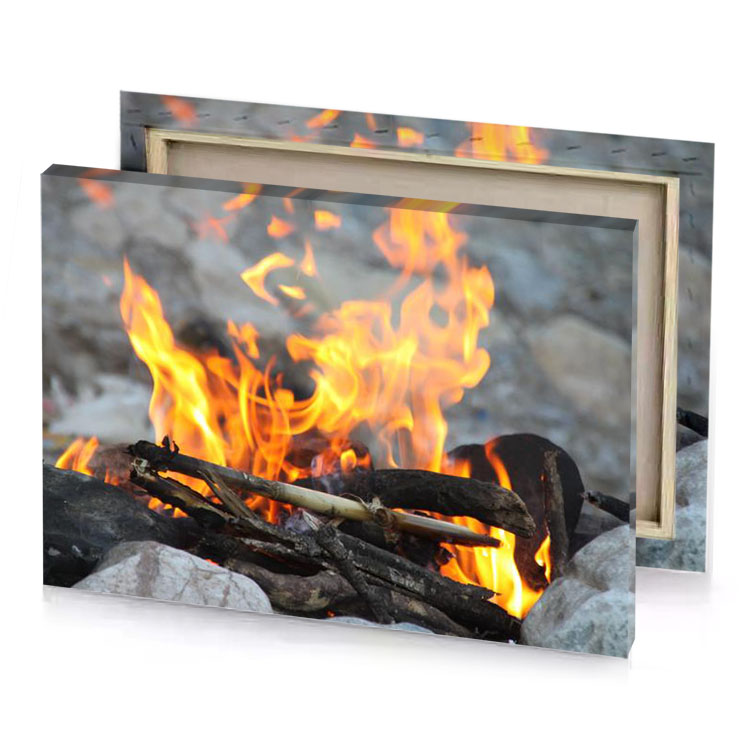 a fire is burning in the middle of pile rocks carrot orange canvas