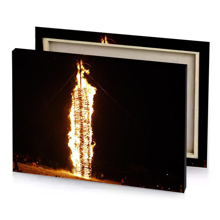 a fire is lit up in the dark sky blanched almond canvas