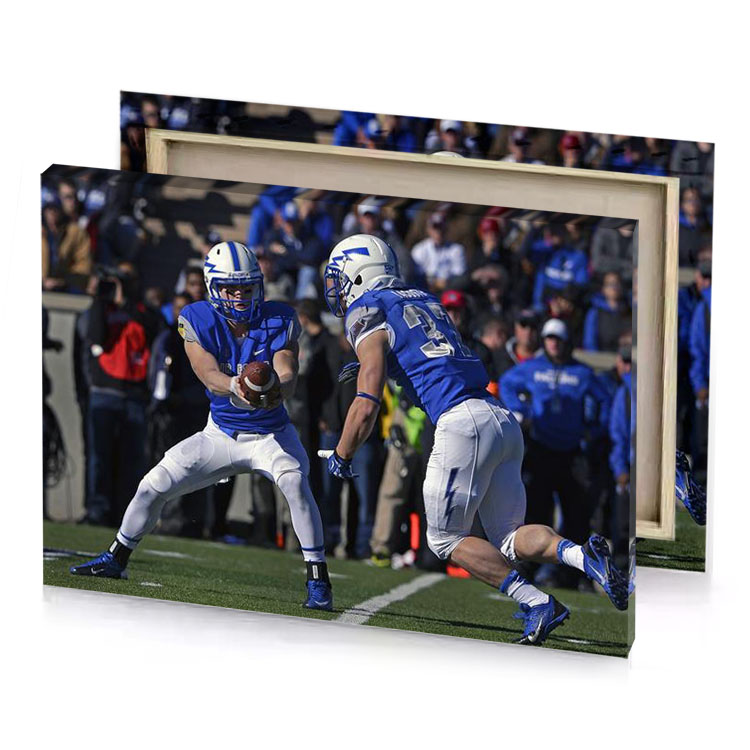 a football player holding midnight blue canvas