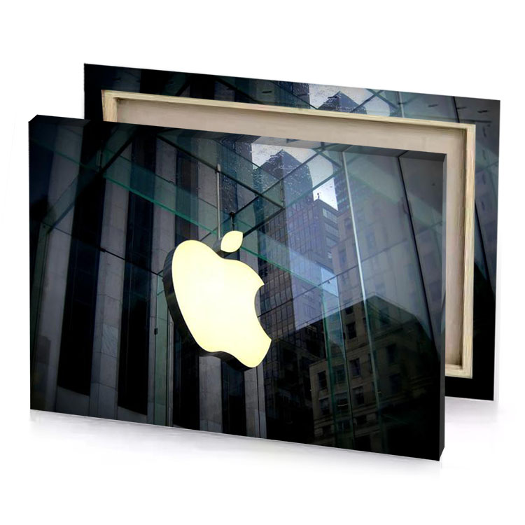 a glass building with yellow apple logo light canvas