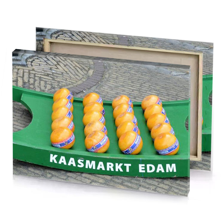 a green and yellow boat with two oranges on it fawn canvas