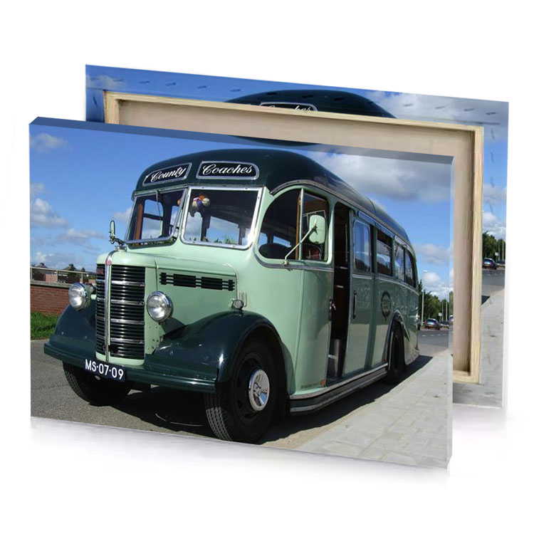 a green bus parked on the side of road dark gray canvas