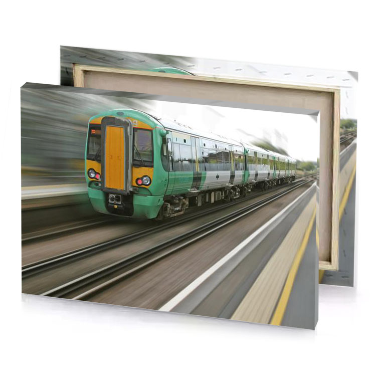 a green train traveling down the tracks copper canvas