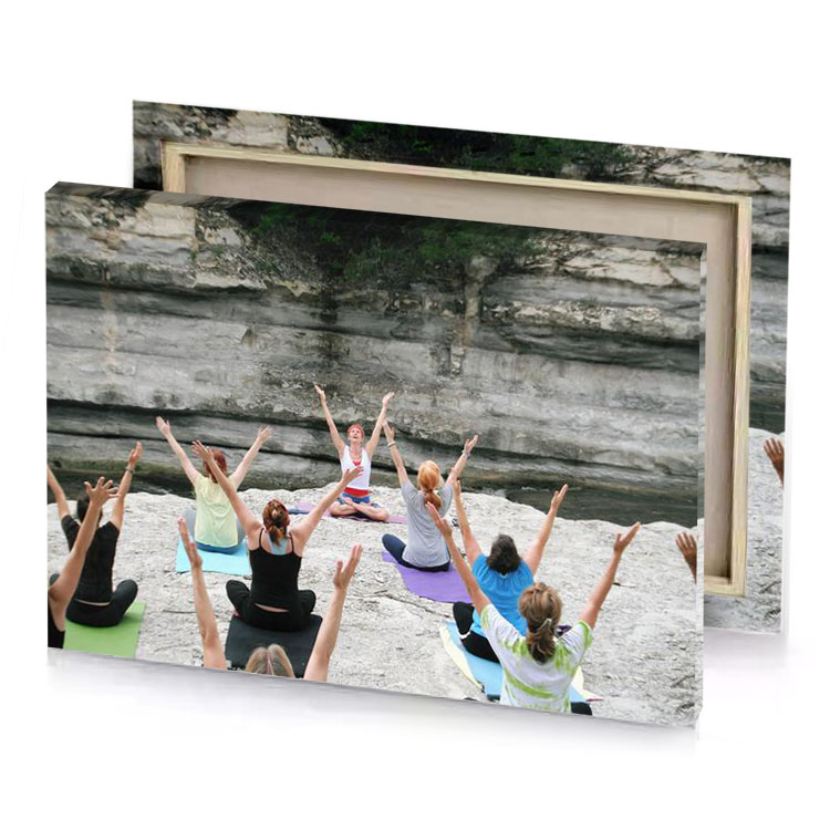 a group of people doing yoga in front rock manatee canvas