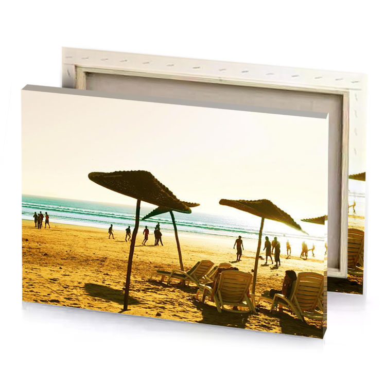 a group of people on beach with umbrellas fawn canvas