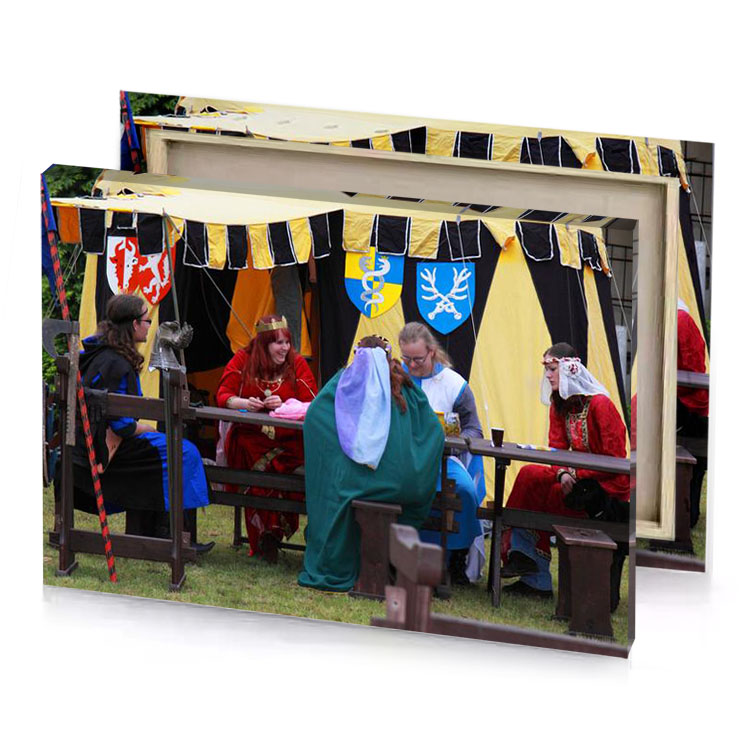 a group of people sitting under yellow tent blue sapphire canvas
